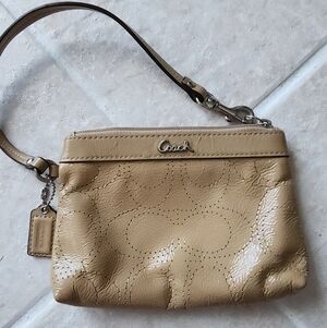 Coach Metallic Perforated Signature C Logo Wristlet. Tan Patent Leather Finish